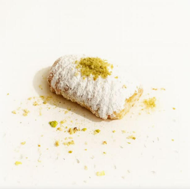 Small Mammoul W/ Pistachio $46.00 Bite-size maamoul cookie with pistachios, lightly dusted with powdered sugar.