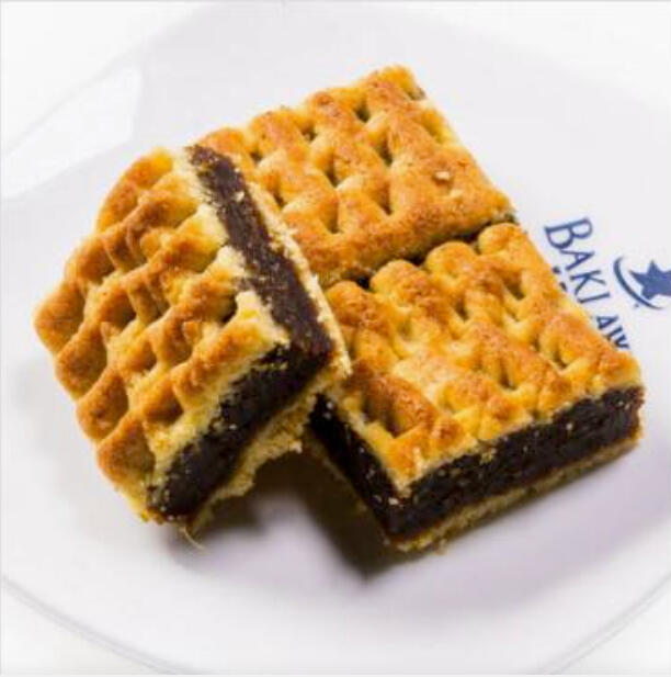 Mammoul Mad W/ Dates $38.00 Tray-baked ma'amoul filled with date paste, cut into tender squares with a classic patterned crust.