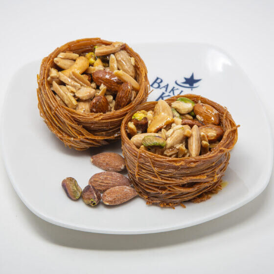 Osh El Bulbul (Bird's Nest) $50.00 Shredded pastry nests filled with pistachios and almonds, lightly glazed in syrup.