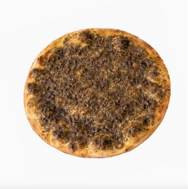 Zaatar Pie $5.25 Classic manakish: flatbread topped with a traditional za’atar herb blend.
