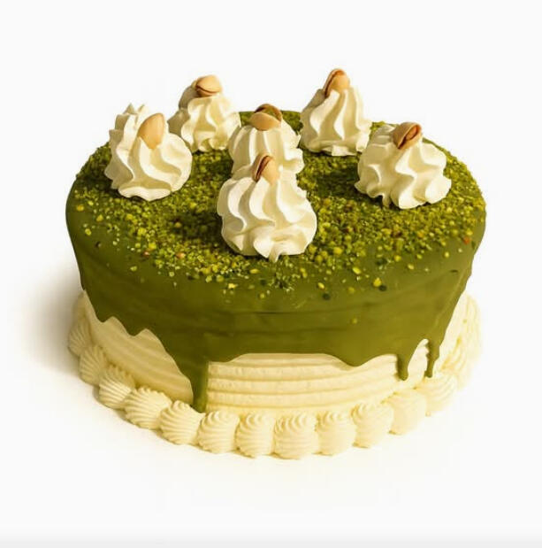 Pistachio Cake (10 inches) $62.99 Classic pistachio cake covered in green pistachio glaze, finished with crushed pistachios and whipped cream rosettes.