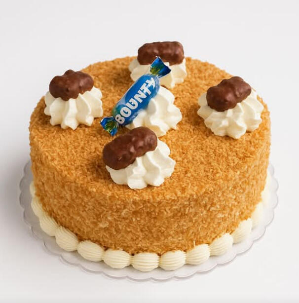 Coconut Cake (10 inches) $62.99 Coconut cake coated in coconut flakes, topped with whipped cream swirls and chocolate-covered coconut pieces.