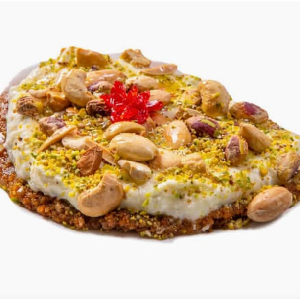 Mafrouki $38.00 Semolina base topped with kashta (clotted cream), sprinkled with crushed pistachios and crowned with mixed nuts.