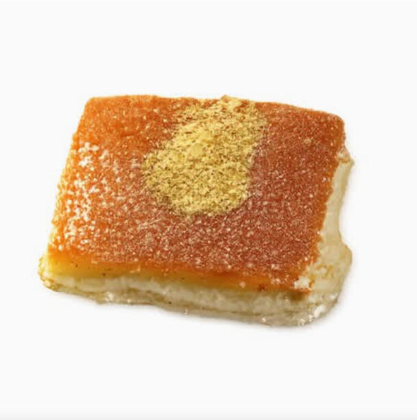Knefeh W/ Cheese $38.00 Knefeh with a fine semolina crust and melty cheese filling, finished with a sprinkle of crushed pistachio.