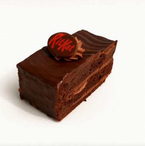 KitKat Cake Slice $7.49 A slice of layered chocolate cake filled with chocolate cream, coated in glossy chocolate, topped with a KitKat chocolate disc.